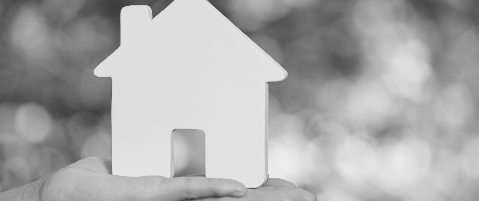 Real estate agent handing the house key